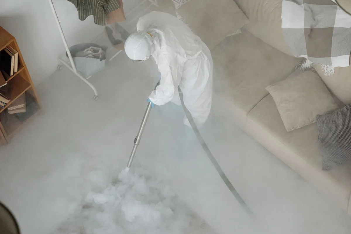 Biohazard cleanup technician in protective equipment, Dalzell, SC